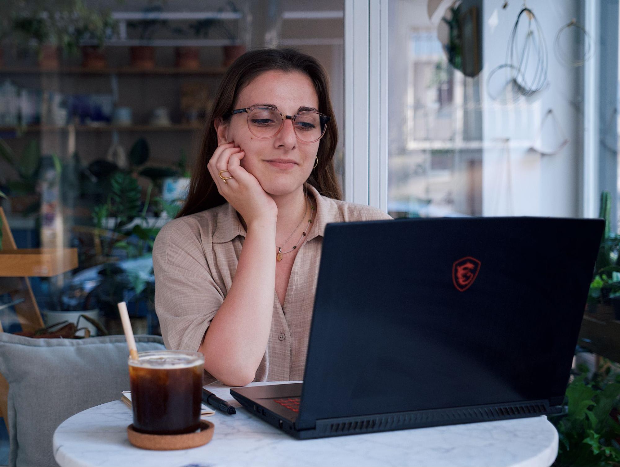 a virtual assistant working on a laptop