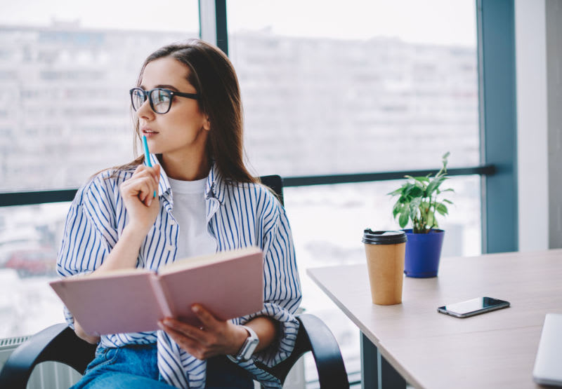 woman sitting in chair thinking 