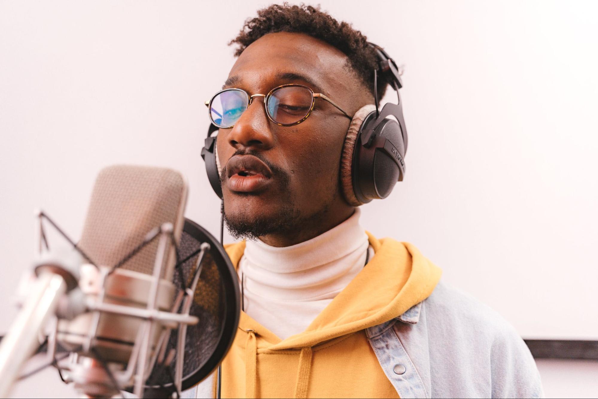 A man recording a voiceover in studio. Antoni Shkraba for Pexels.