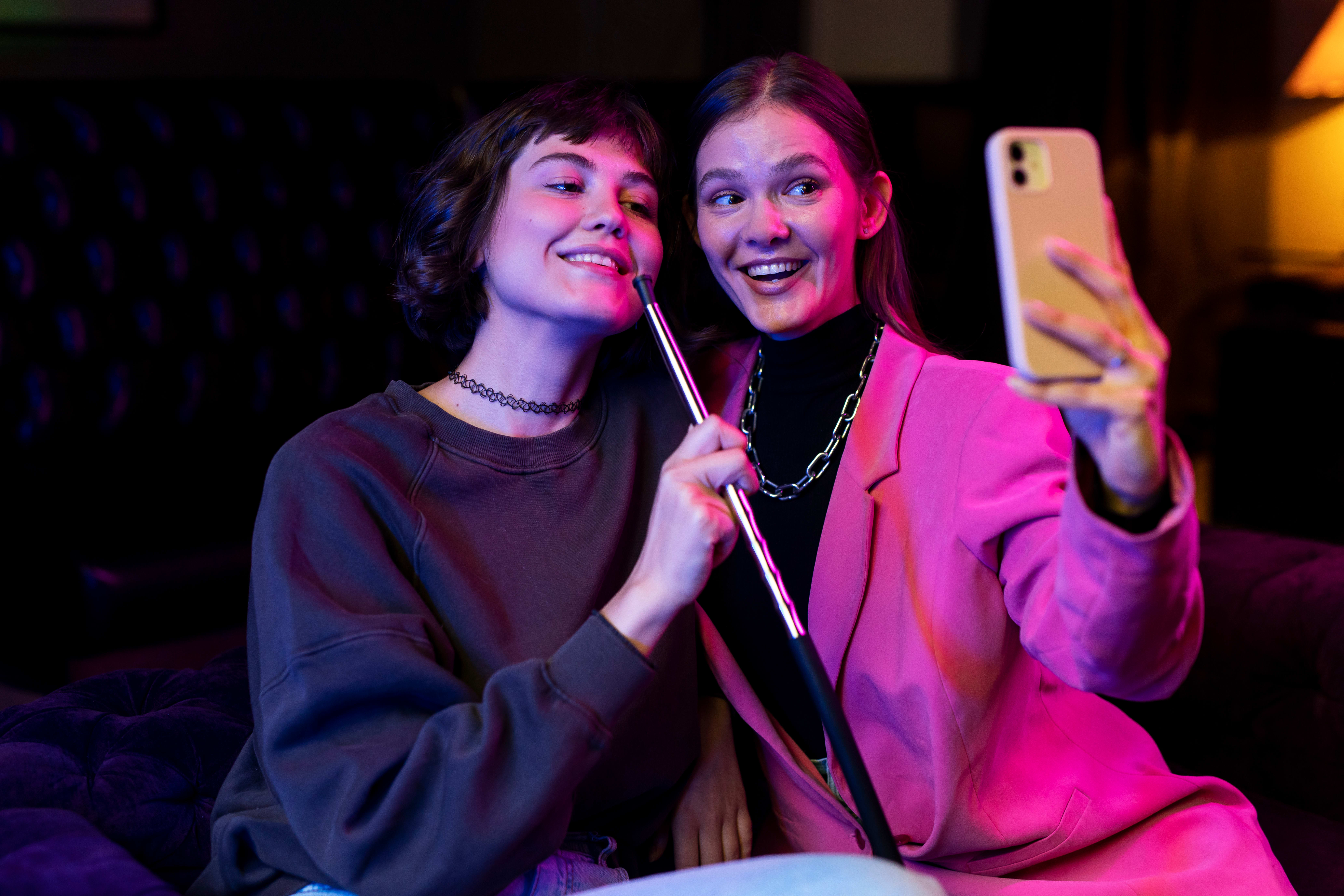 Women taking selfie video for TikTok