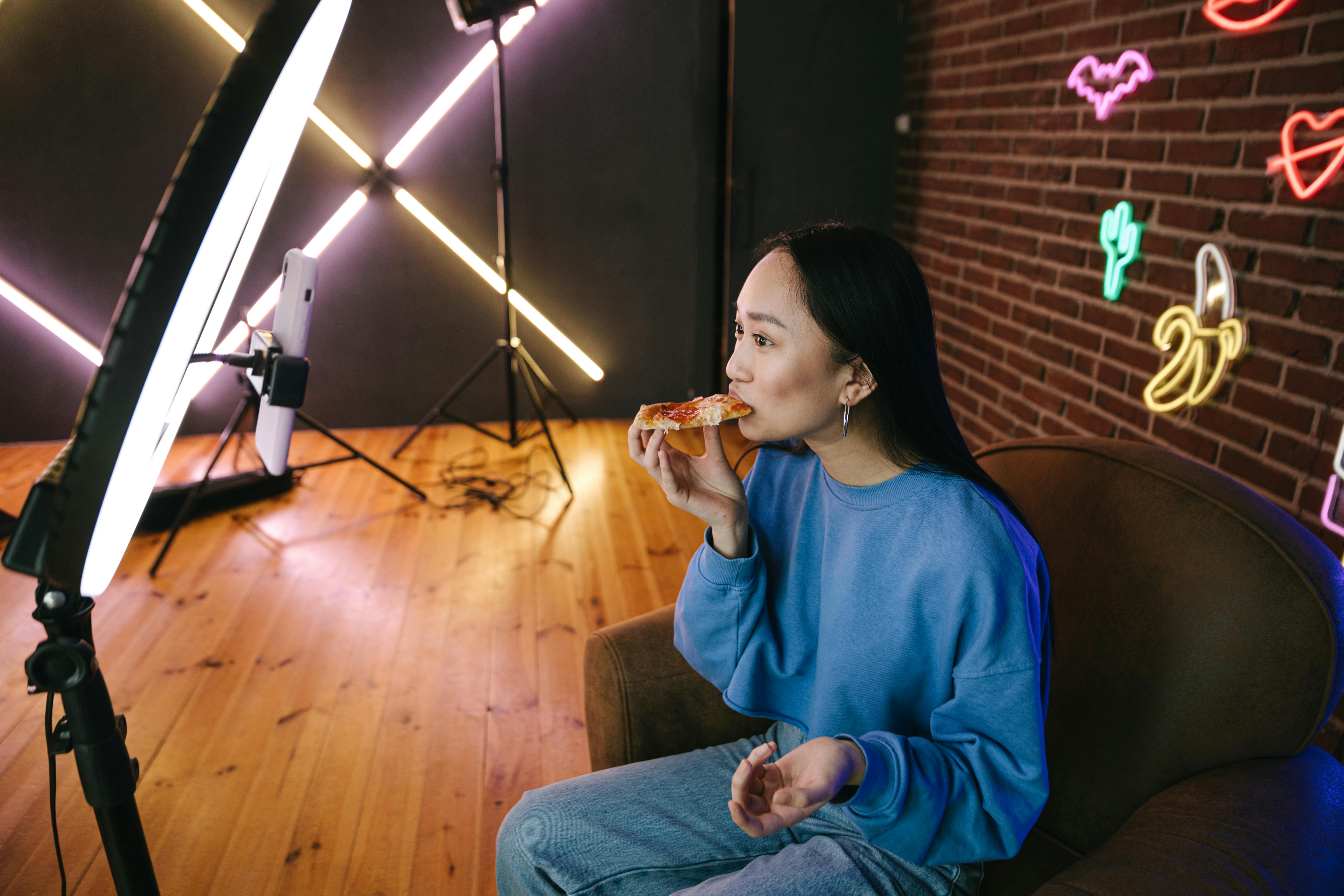 Girl behind light and camera making video for TikTok