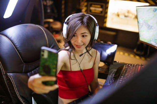 Woman taking a selfie smiling while streaming