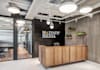 create 25 realistic office wall mockups featuring your logo
