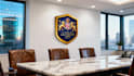 create 25 realistic office wall mockups featuring your logo