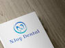 design a modern dental logo with initials or tooth icon