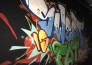 paint real graffiti art on the street wall