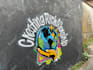 paint real graffiti art on the street wall