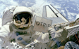place your message or logo on a sign held by an astronaut