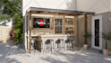 design and render a stunning 3d outdoor kitchen and bar with realism