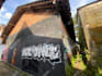 paint real graffiti art on the street wall