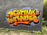 paint real graffiti art on the street wall