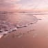 create custom sandwriting ai art on a beautiful beach