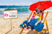 promote your dog logo on laptop with funny dog on beach