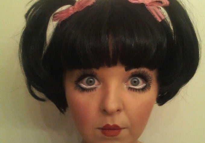 Dress up like a doll and answer any question you want to ask me by