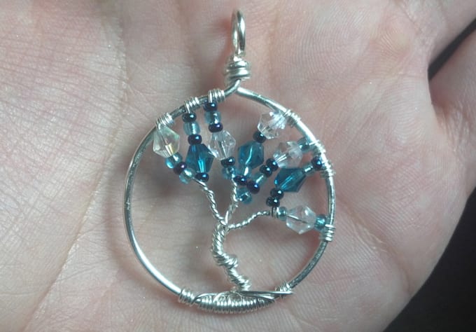 send you this sterling plated winter tree pendant