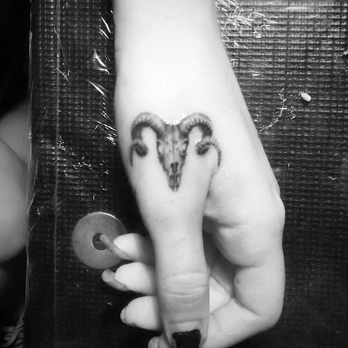 design a custom hand tattoo with experience as tattoo artist
