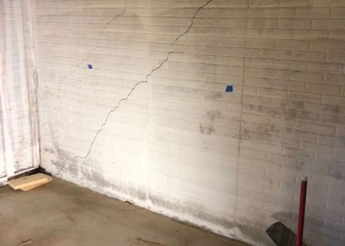 assess foundation cracks, settlement and structural distress