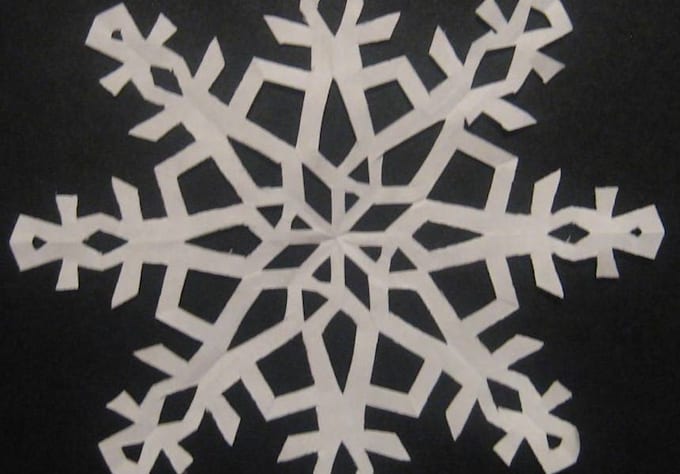 cut out Five Unique Individual Paper Snow Flakes
