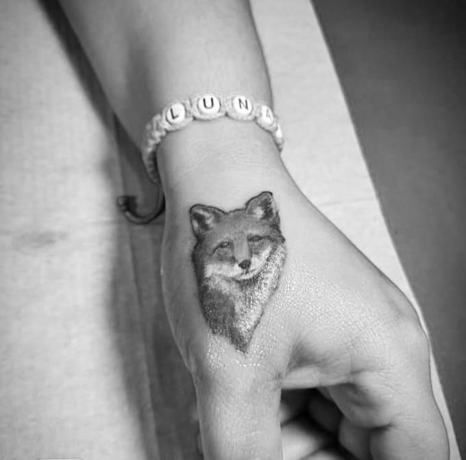 design a custom hand tattoo with experience as tattoo artist