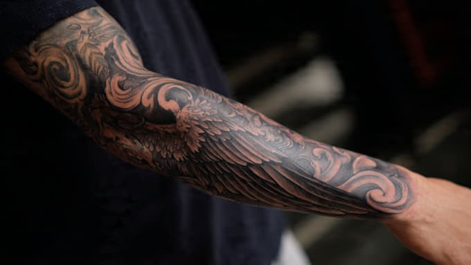 create a tattoo design of tattoo sleeve