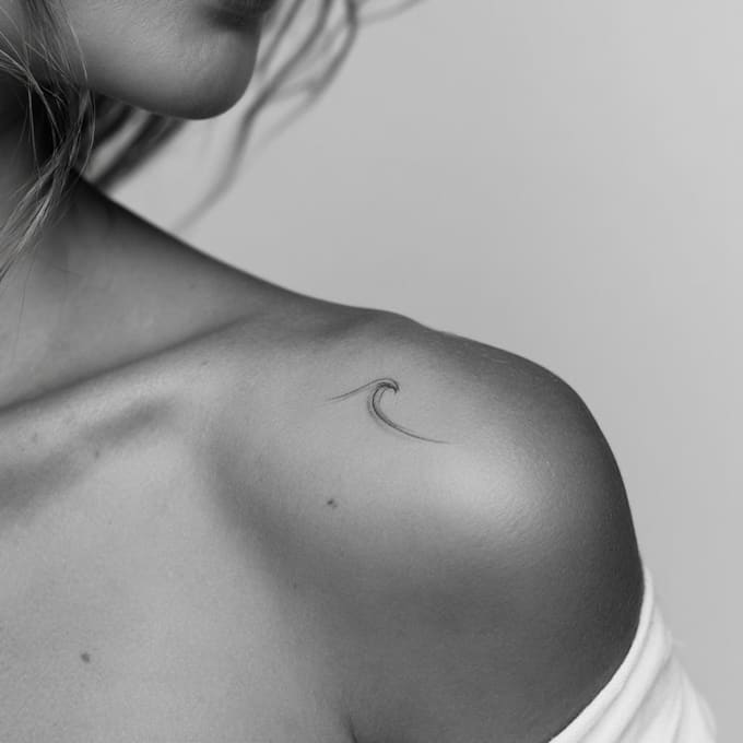 create a small minimalistic fine line spiritual tattoo