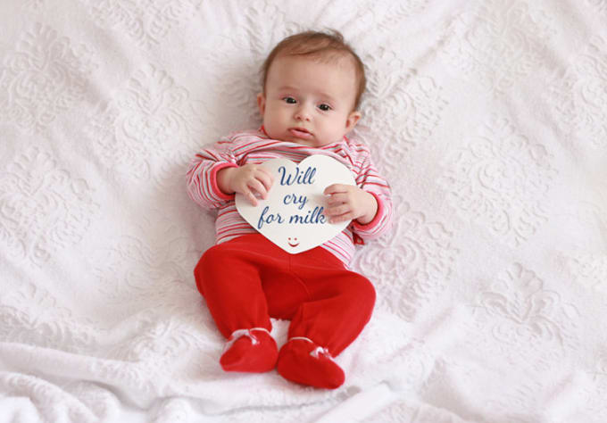 Photograph my cute baby girl holding a paper with your message by Georfy