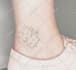 create a minimalist fine line tattoo design