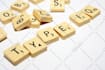 take a high res photo of any words for you with scrabble tiles and send the digital picture for you to use as you please
