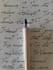 write antique handwritten text in white cotton paper