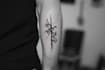create arabic and persian minimal calligraphy tattoo