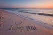 create custom sandwriting ai art on a beautiful beach