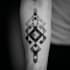custom a geometric realism in black and grey tattoo design