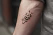create arabic and persian minimal calligraphy tattoo