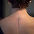 create a small, minimalistic, fine line spiritual tattoo
