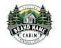 design eye catching cabin in mountains logo