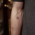 create a small, minimalistic, fine line spiritual tattoo