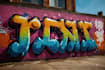 paint real graffiti art on the street wall