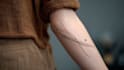design a minimalist fine line tattoo