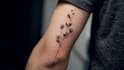 create arabic and persian minimal calligraphy tattoo
