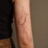 create a minimalist fine line tattoo design