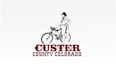 make custer county tourism biking cowboy logo
