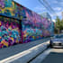 paint real graffiti art on the street wall