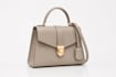 design a realistic 3d purse with professional product renders