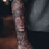 create a detailed custom full sleeve tattoo design