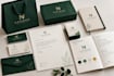 design a complete brand identity with packaging and stationery kit