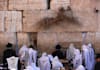 place your prayer note  in the Western Wall in Jerusalem