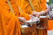 offer food or alms to the buddhist monk on your behalf