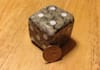 hand sculpt a large dice out of real stone