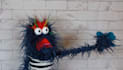 create a fun video with a blue hairy monster puppet