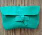 teach you how to sew a clutch using recycled materials